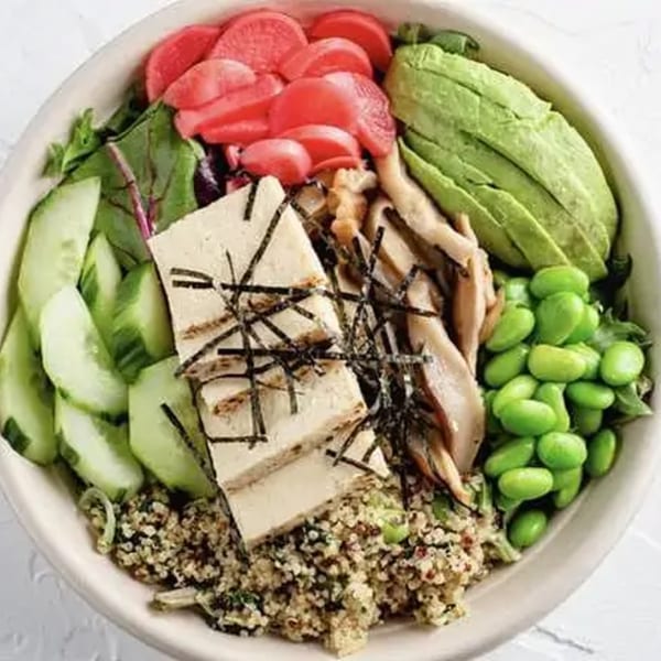 Poke Mahi Naples poke bowl with tofu, avocado, edamame, pickled radishes, cucumbers, and quinoa.